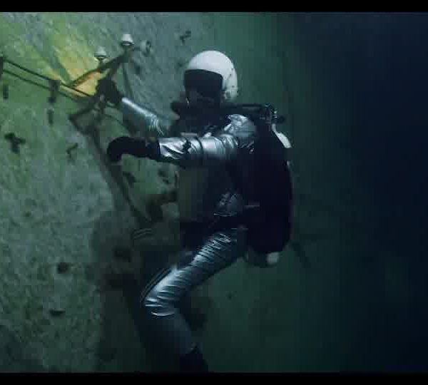 Diver_with_a_flashlight_exploring_the_Kobanya_underwater_mines_161129YT